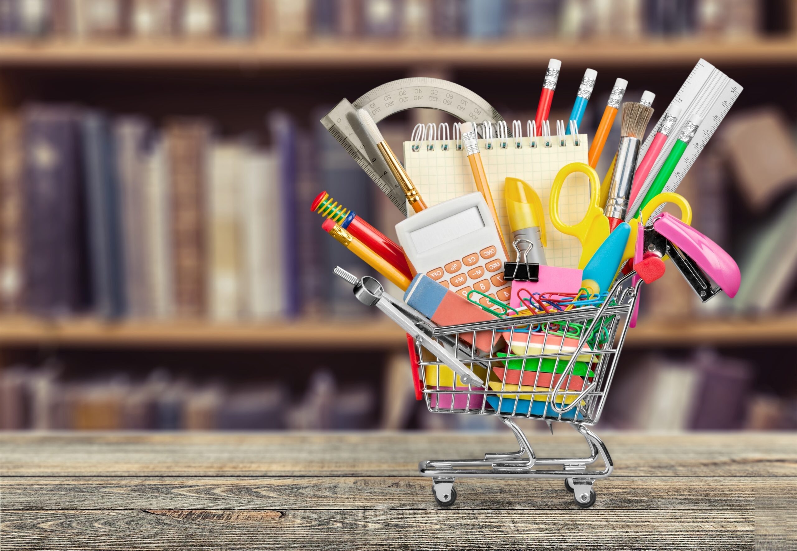 Stationery objects in mini supermarket cart